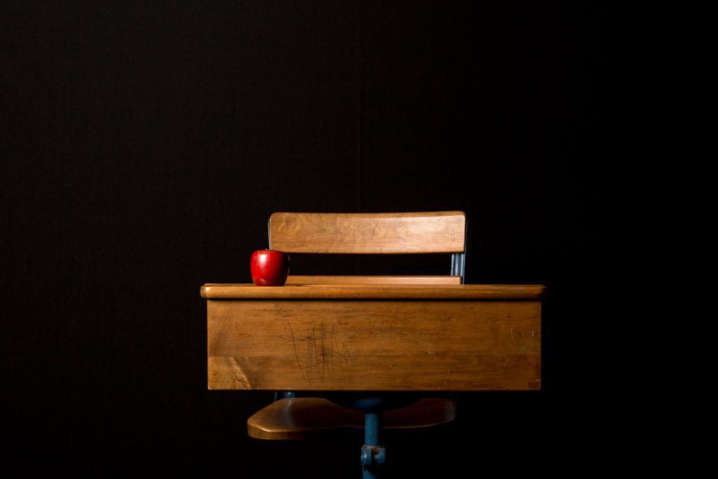 desk with a red apple