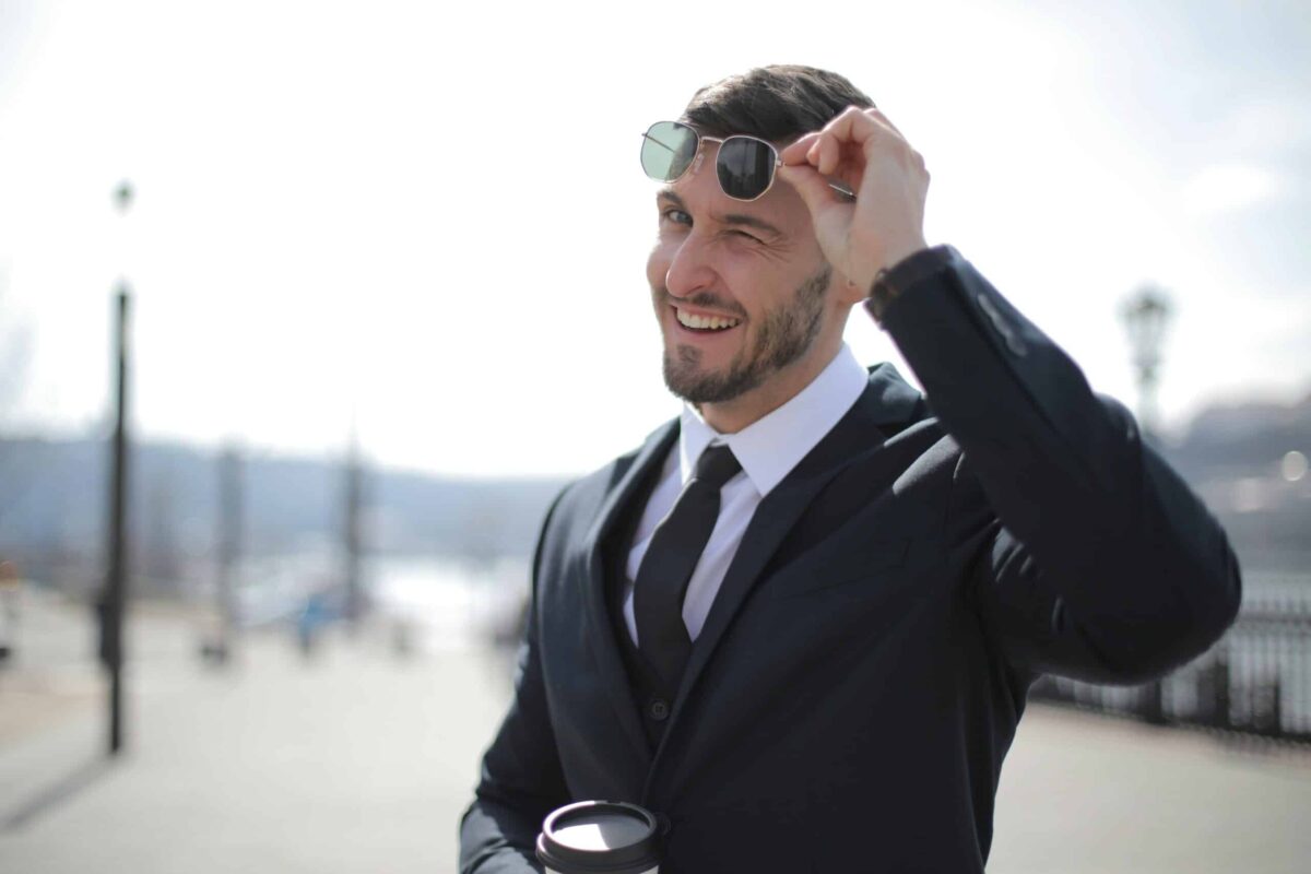 winking business man enjoys being on camera