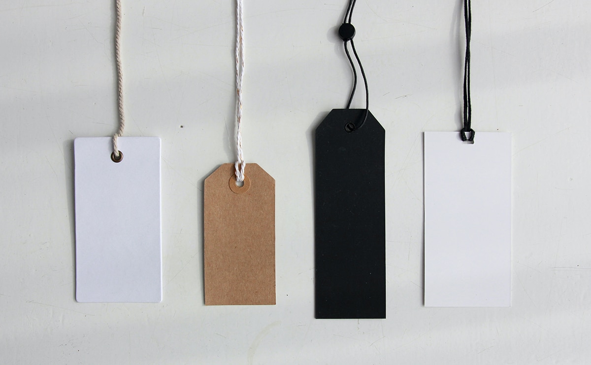 Four tags against a gray background