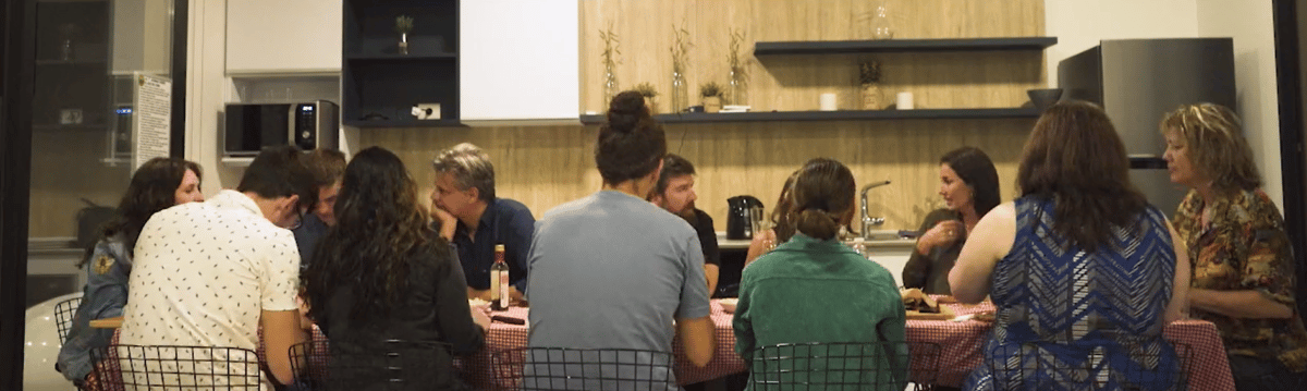 the IdeaRocket team from the U.S. and Buenos Aires gathers  around a table to share a meal