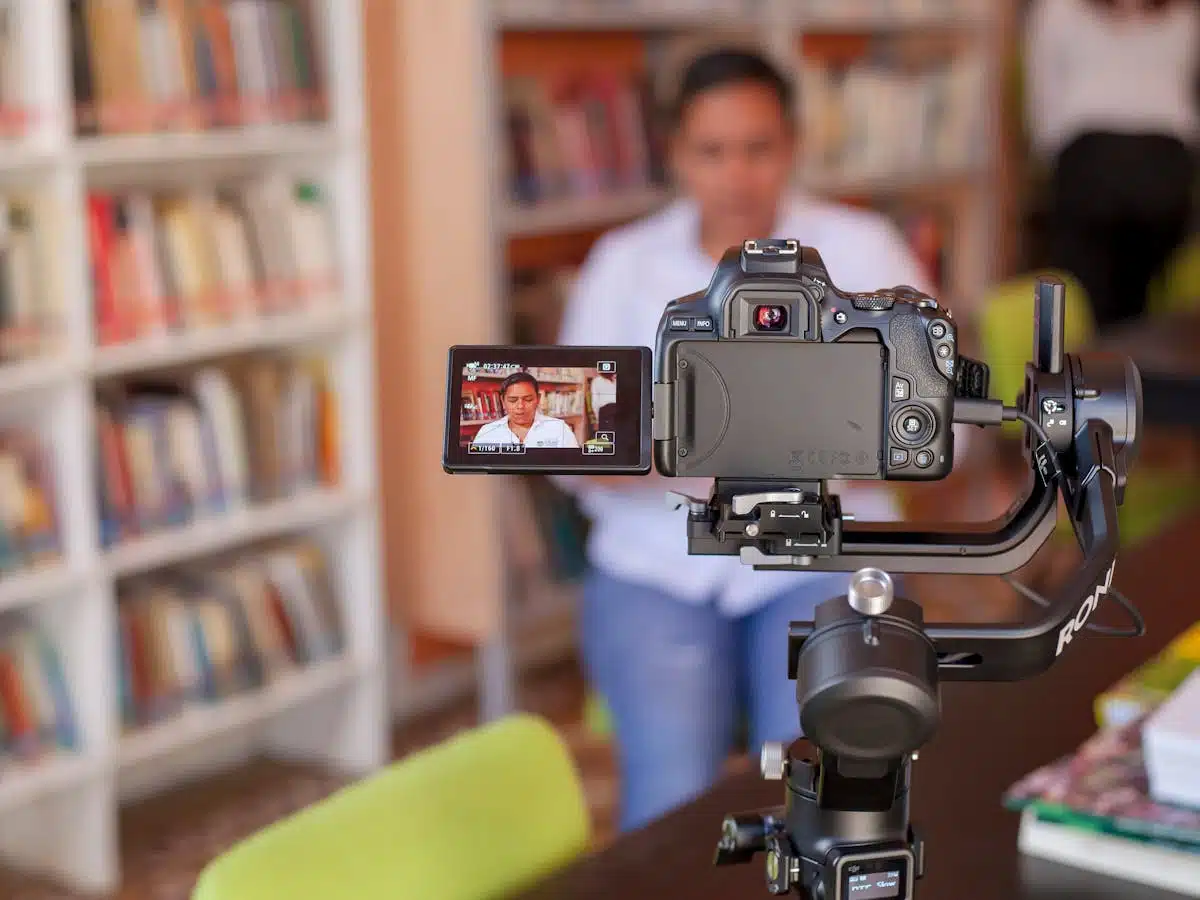 a camera with a viewscreen open shows a B2B influencer recording a video